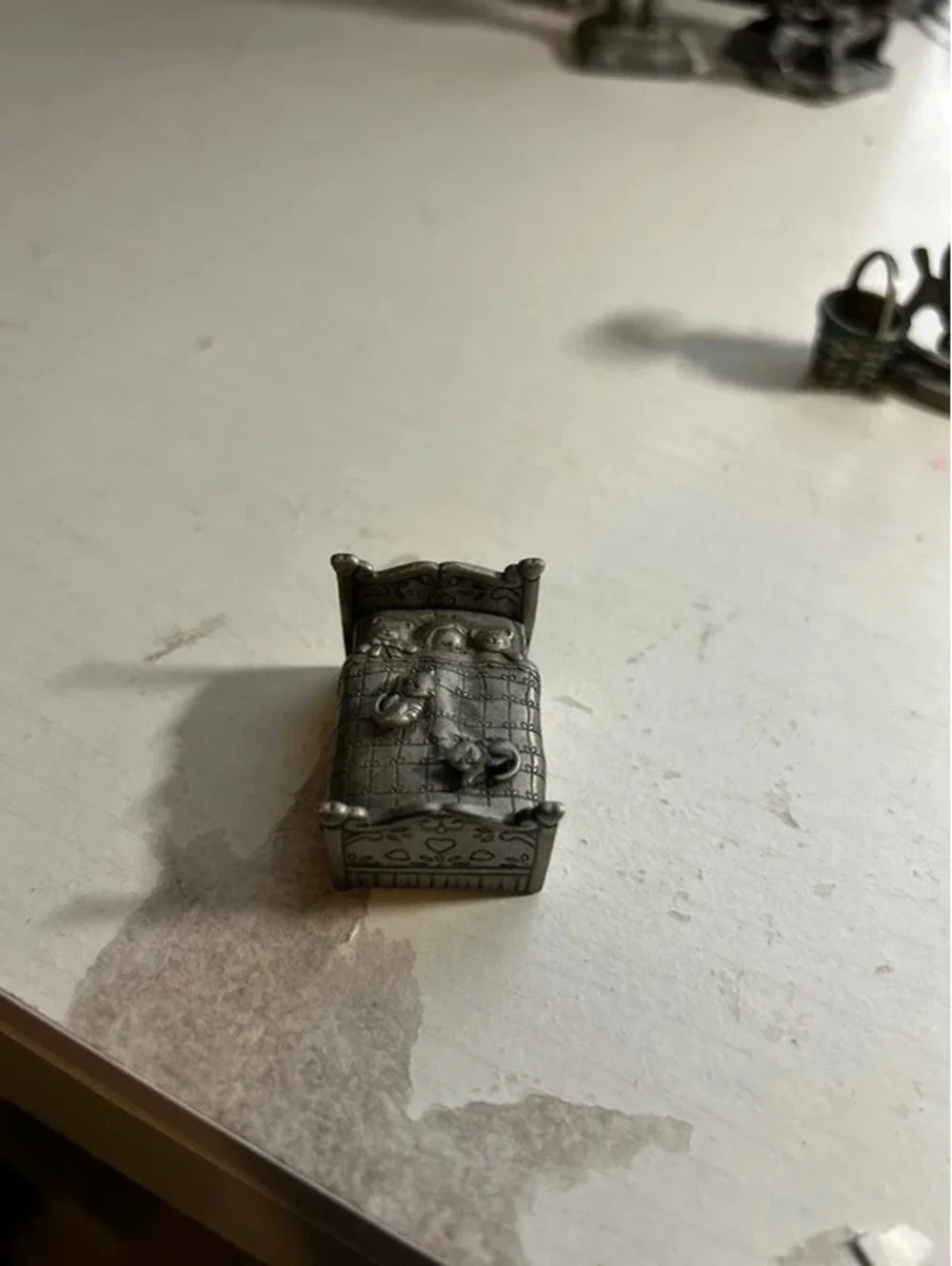 Pewter cat bed with earrings